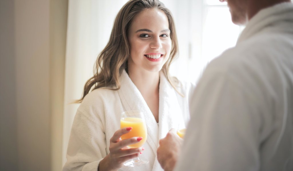 rsz_smiling-woman-with-glass-of-fresh-juice-at-home-3756453