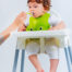 Toddler eating puree with a spoon