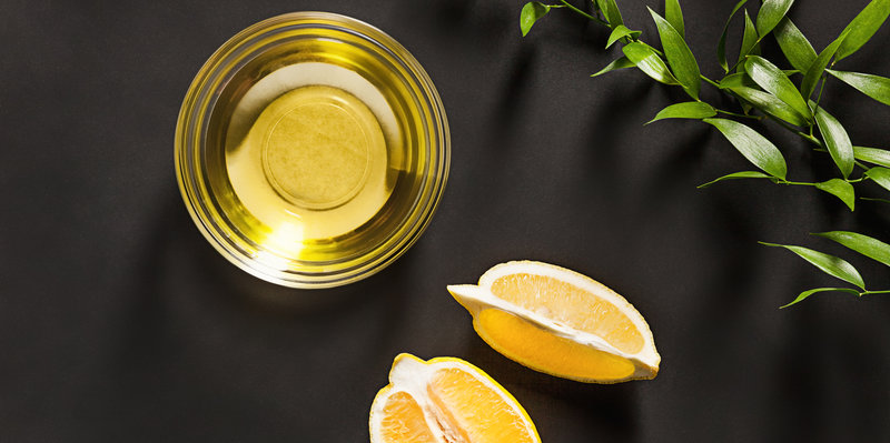 Lemon oil isolated on black table