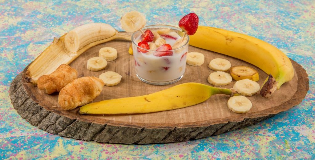 strawberry and banana slices in creamy sauce