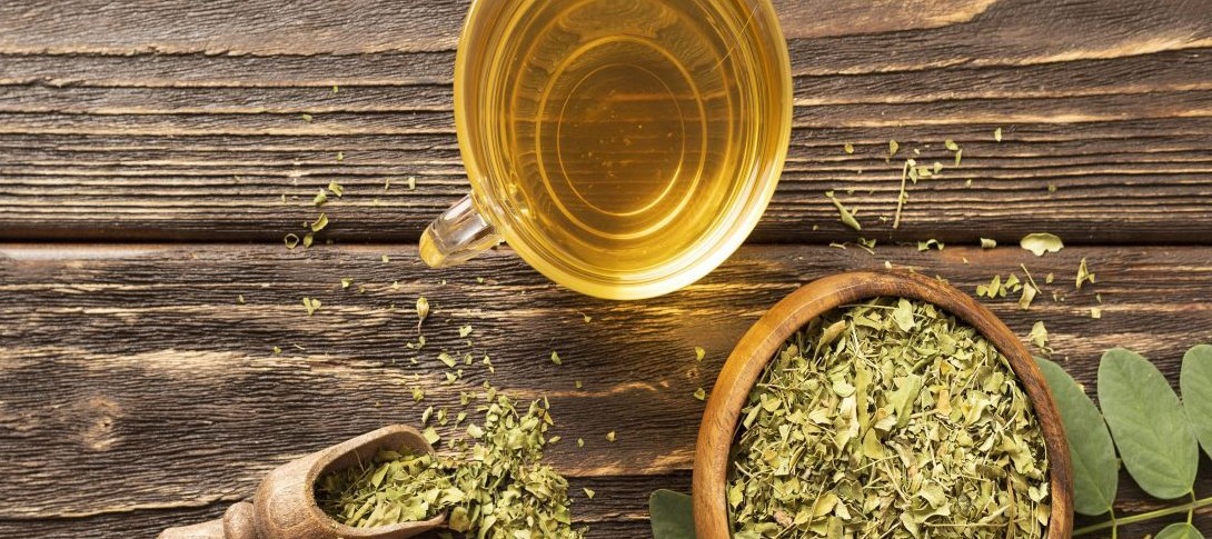 flat-lay-green-leaves-cup-tea Moringa hair spray