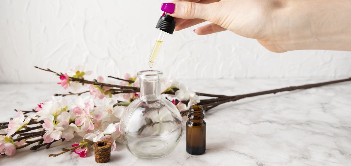 high-angle-hand-using-body-seum geranium essential oil