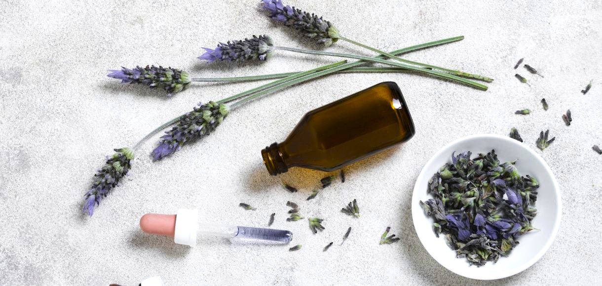 top-view-glass-bottle-lavender lavender essential oil