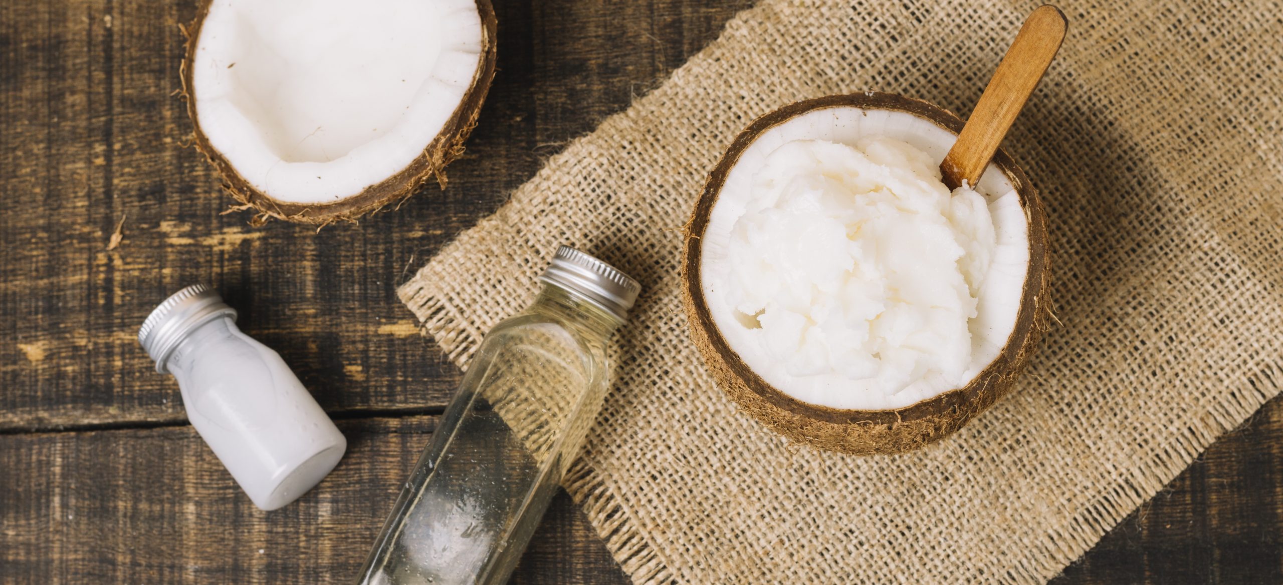 top-view-coconut-oil-with-coconut-composition cold pressed coconut oil